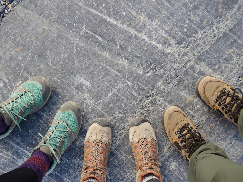 semi-circle of people's hiking footwear
