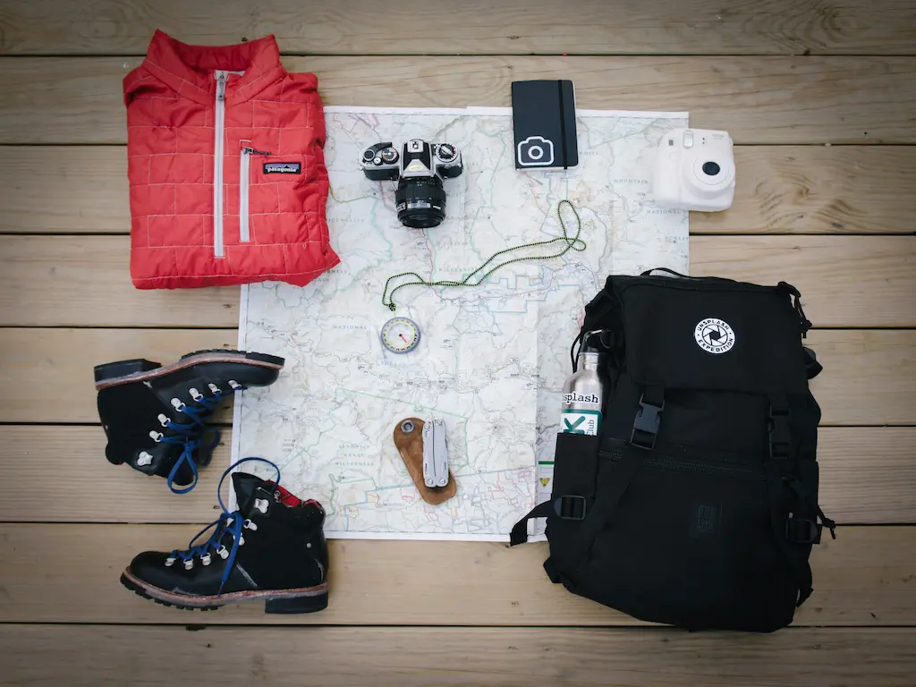 Hiking gear laid out over a map